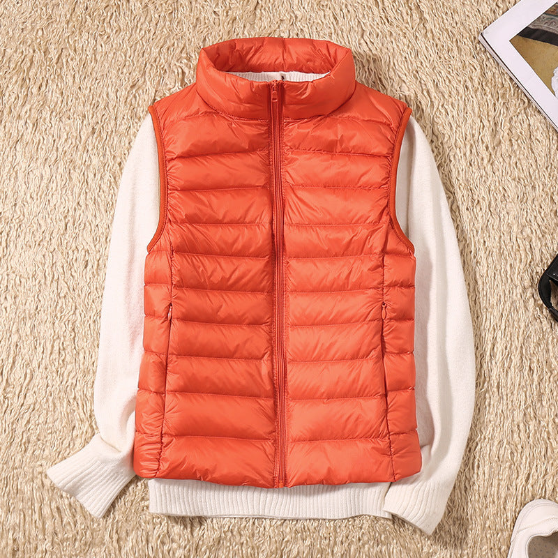 Sleeveless zip vest with high neck collar