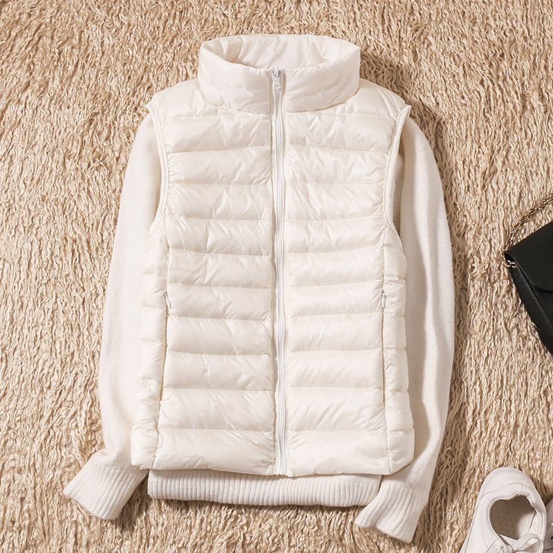Sleeveless zip vest with high neck collar