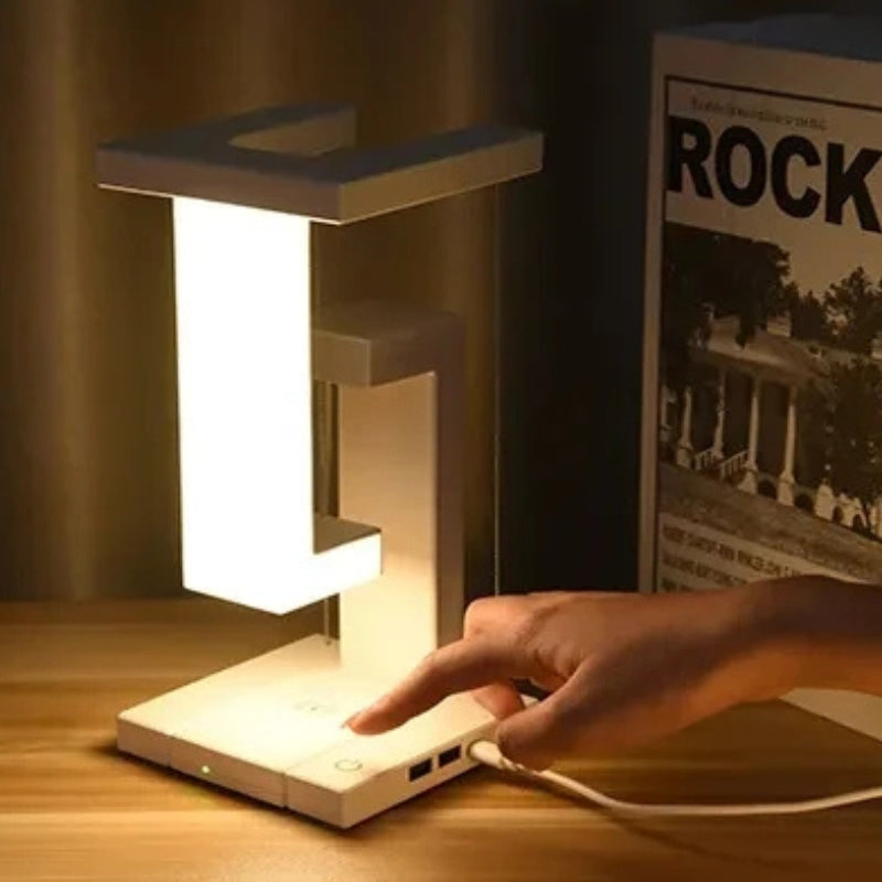 FloatLume – Lampă de masă LED cu design plutitor și încărcător wireless