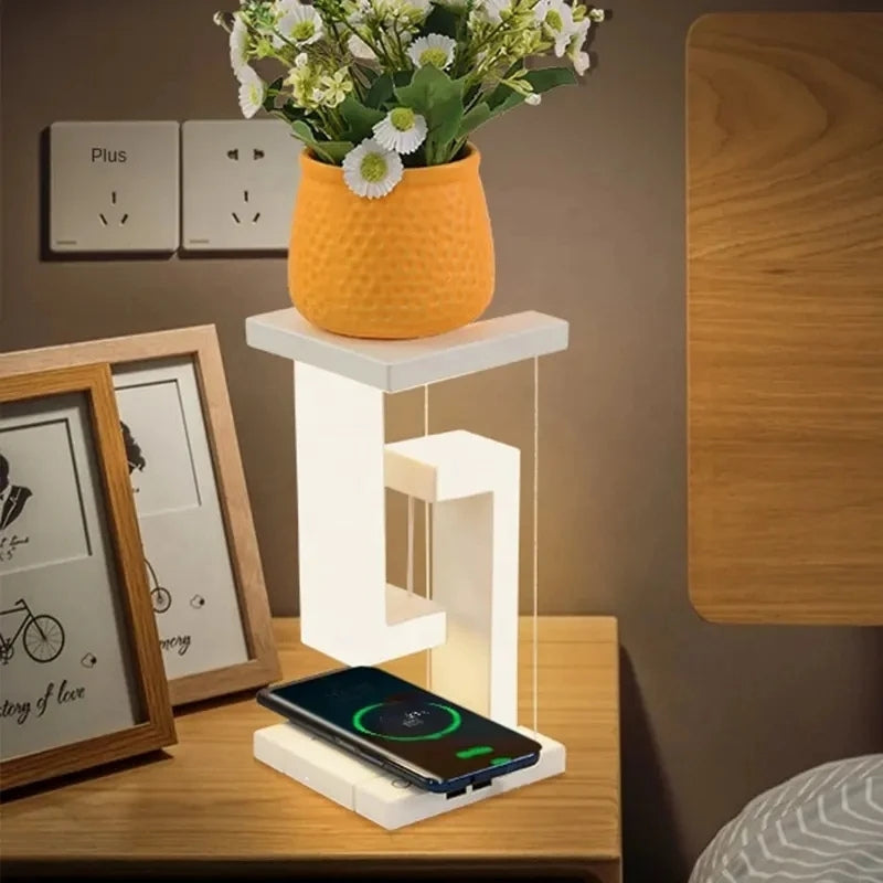 FloatLume – Lampă de masă LED cu design plutitor și încărcător wireless
