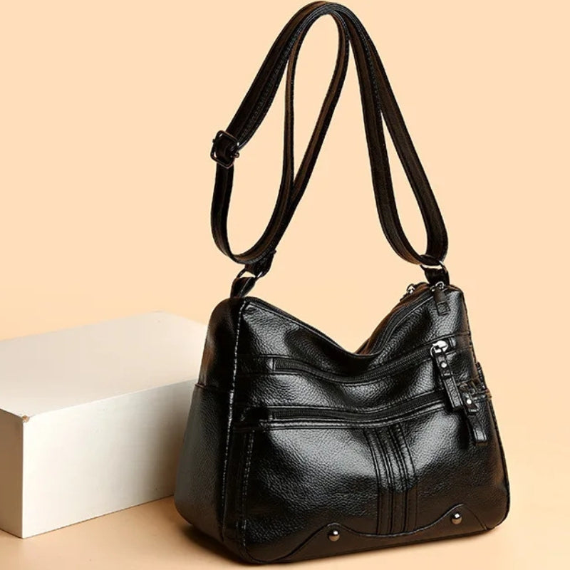Kyra – Sac bandoulière avec bandoulière réglable et plusieurs compartiments zippés