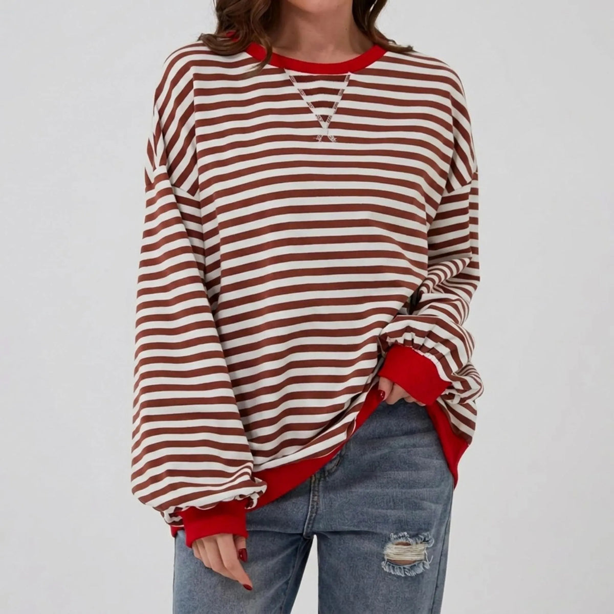 StripeCross – Oversized Striped Sweater with Round Neck and Cross-Stitch Detail