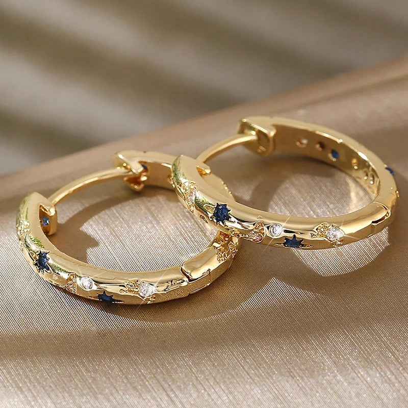 Celeste – Eye-catching hoop earrings with moon and star details