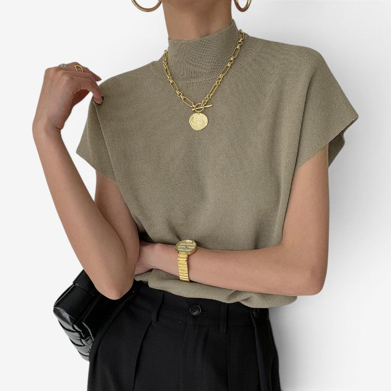 Blusa a coste da donna con collo alto