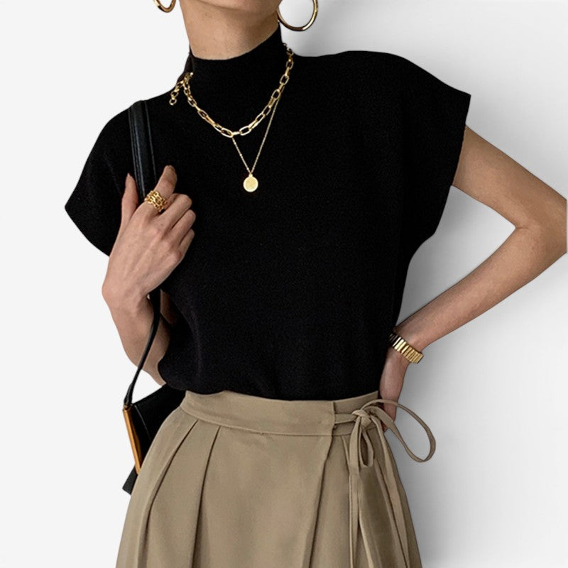 Blusa a coste da donna con collo alto