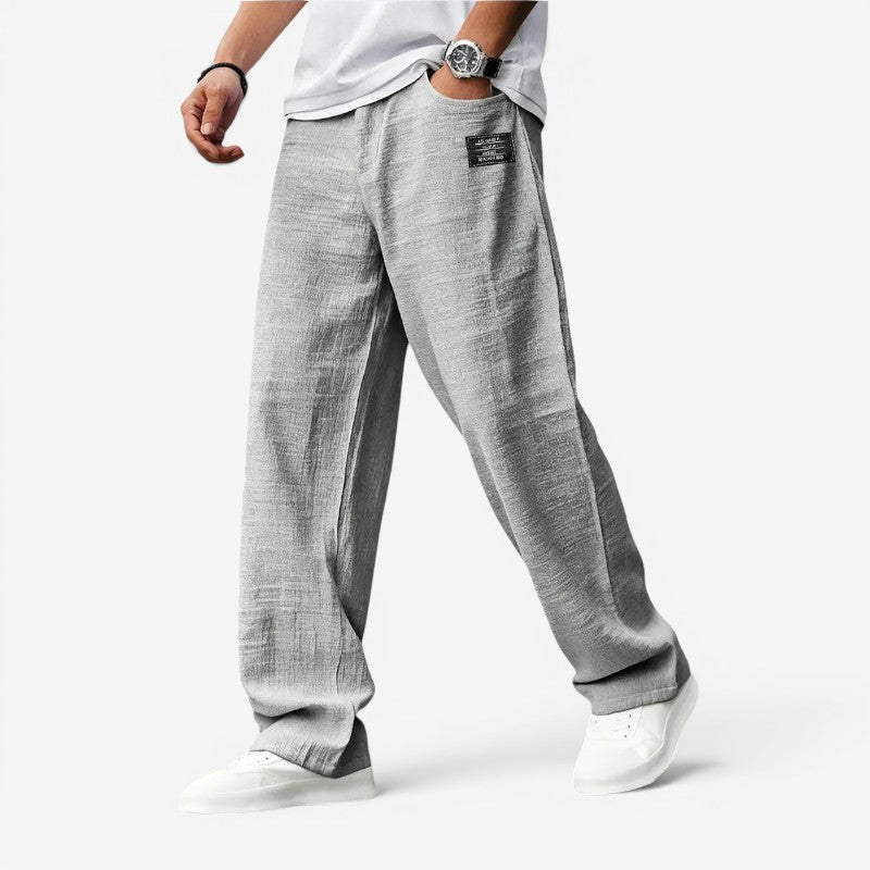 Pantaloni bărbătești cu croială largă și buzunare laterale