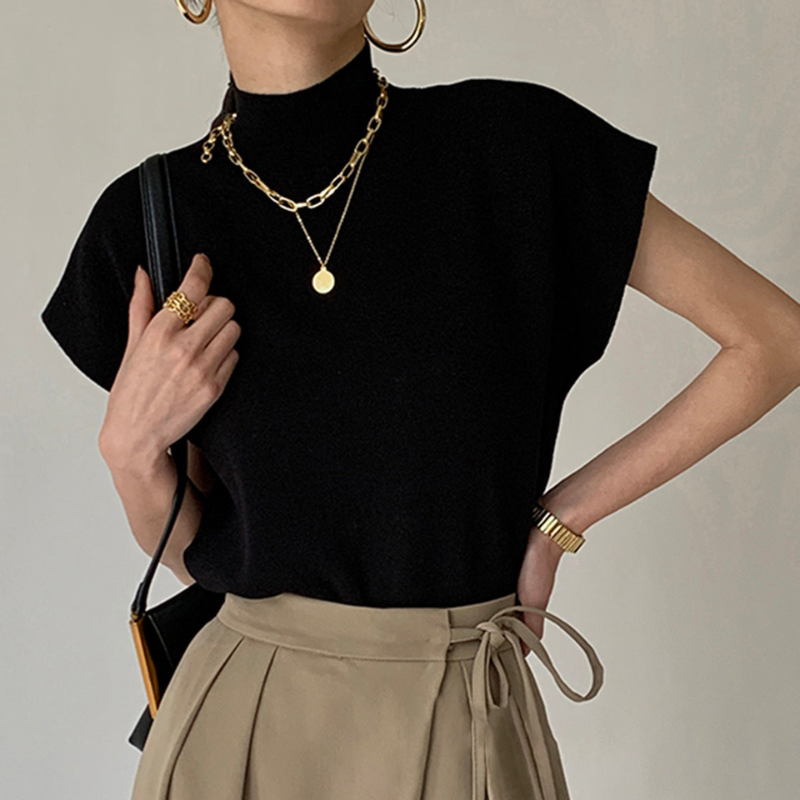 Blusa a coste da donna con collo alto