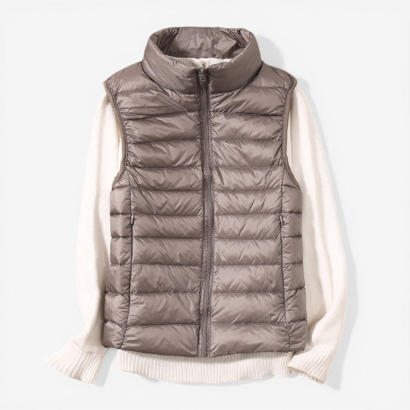 Sleeveless zip vest with high neck collar