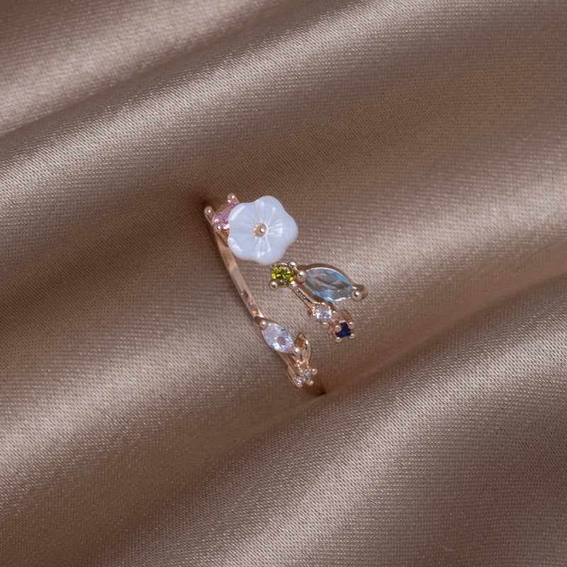 Liora – Modern whimsical ring with leaf-inspired gemstone accents and artistic open design