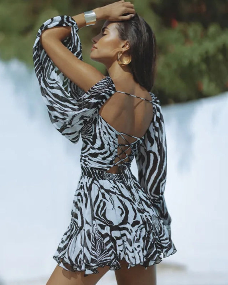 Anna - Mini-robe stylée avec profond col en V et motif léopard