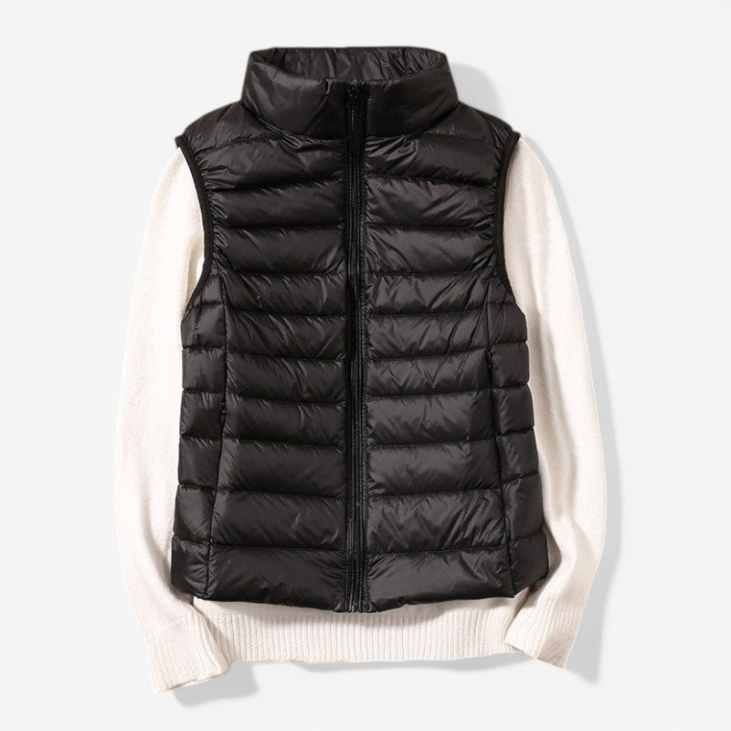 Sleeveless zip vest with high neck collar