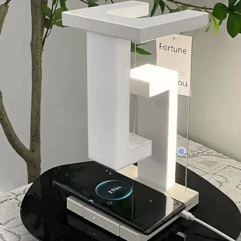 FloatLume – Lampă de masă LED cu design plutitor și încărcător wireless