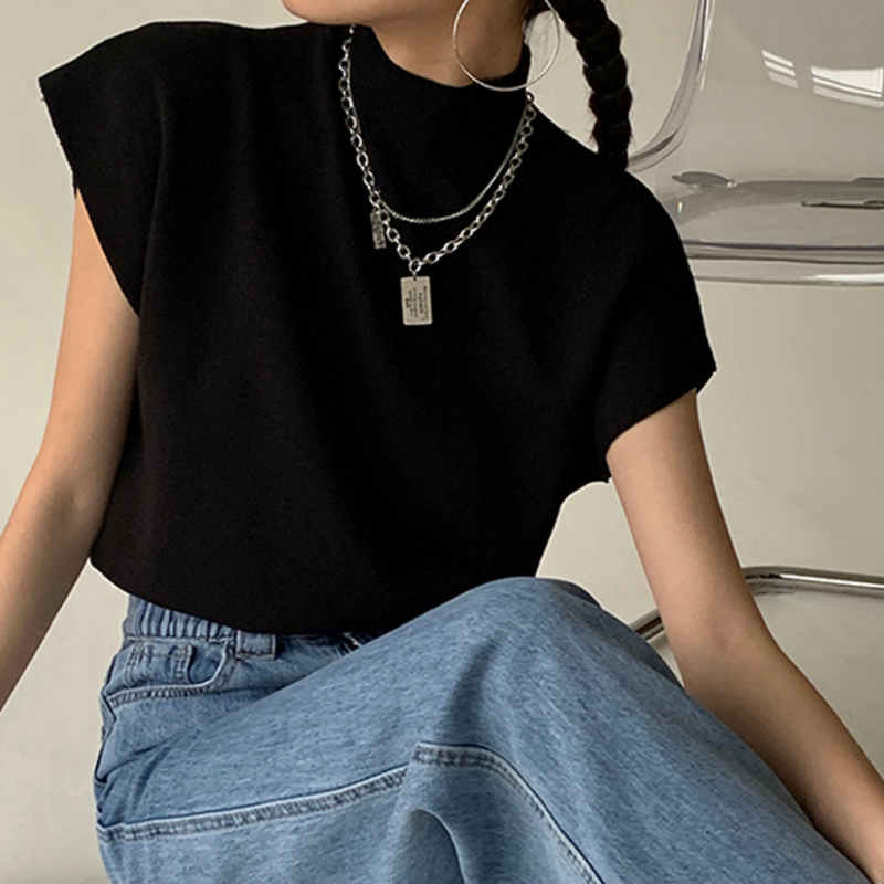 Blusa a coste da donna con collo alto