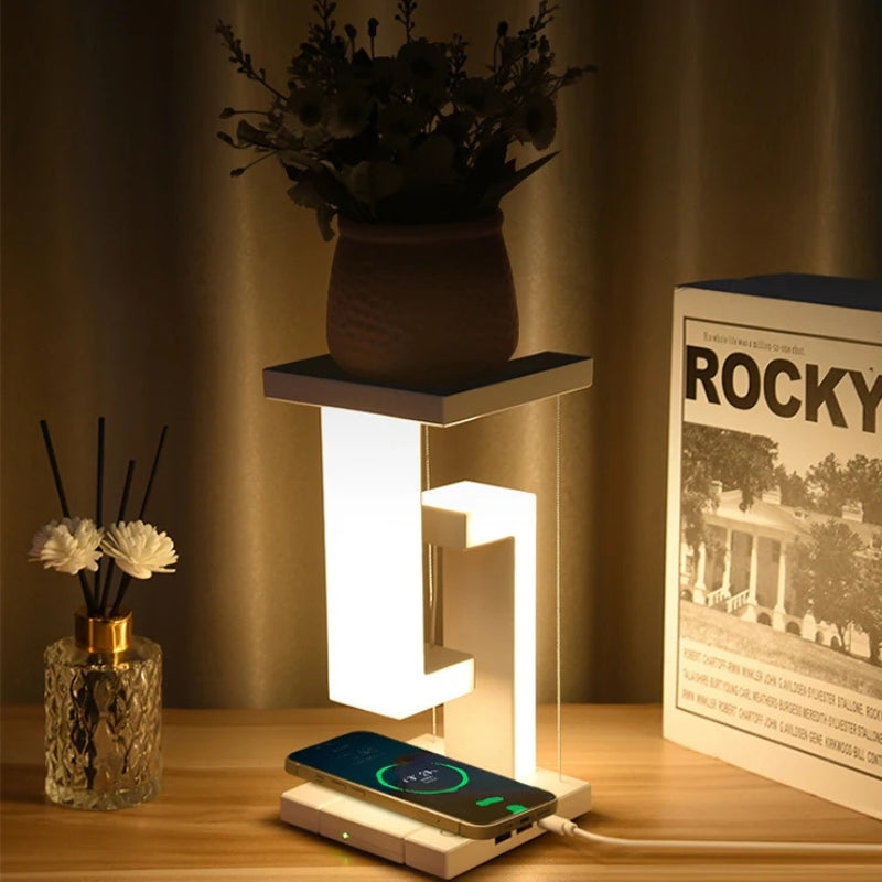 FloatLume – Lampă de masă LED cu design plutitor și încărcător wireless