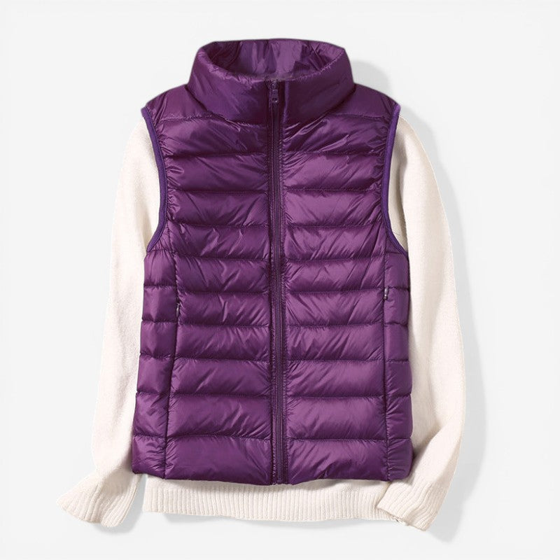 Sleeveless zip vest with high neck collar