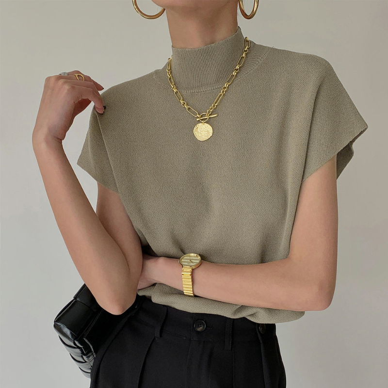 Blusa a coste da donna con collo alto