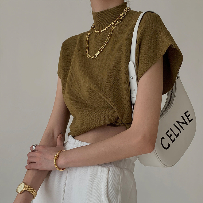 Blusa a coste da donna con collo alto