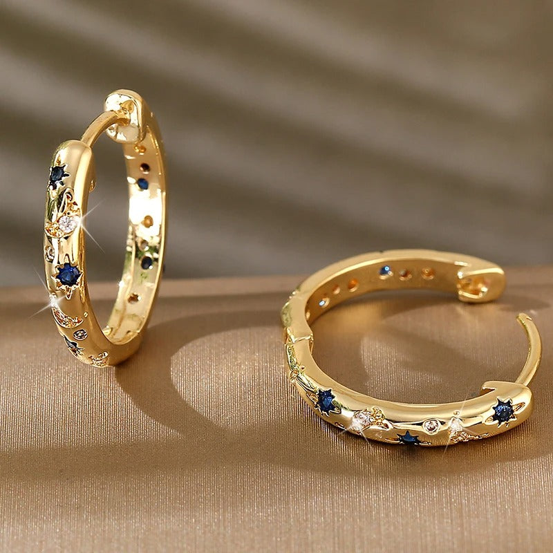 Celeste – Eye-catching hoop earrings with moon and star details