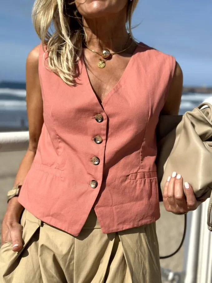 Eva – Gilet à boutons sur le devant avec deux poches pratiques