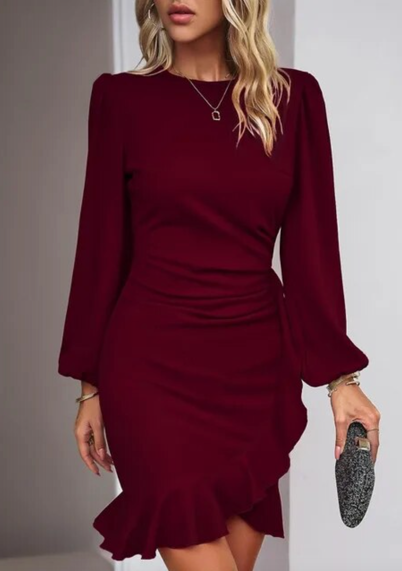 Belia – Rochie elegantă cu mâneci lungi, croială avantajoasă și tiv cu volane
