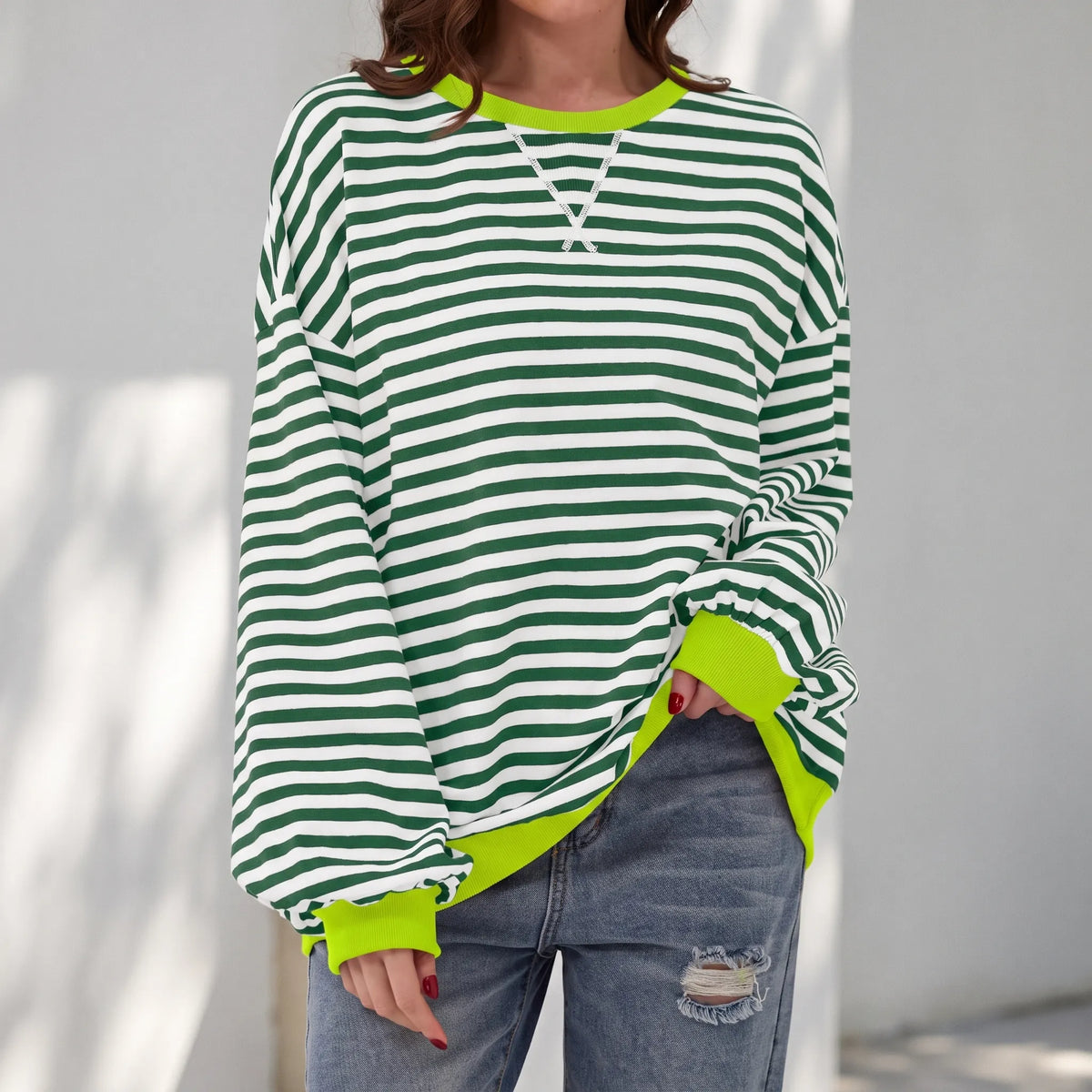 StripeCross – Oversized Striped Sweater with Round Neck and Cross-Stitch Detail