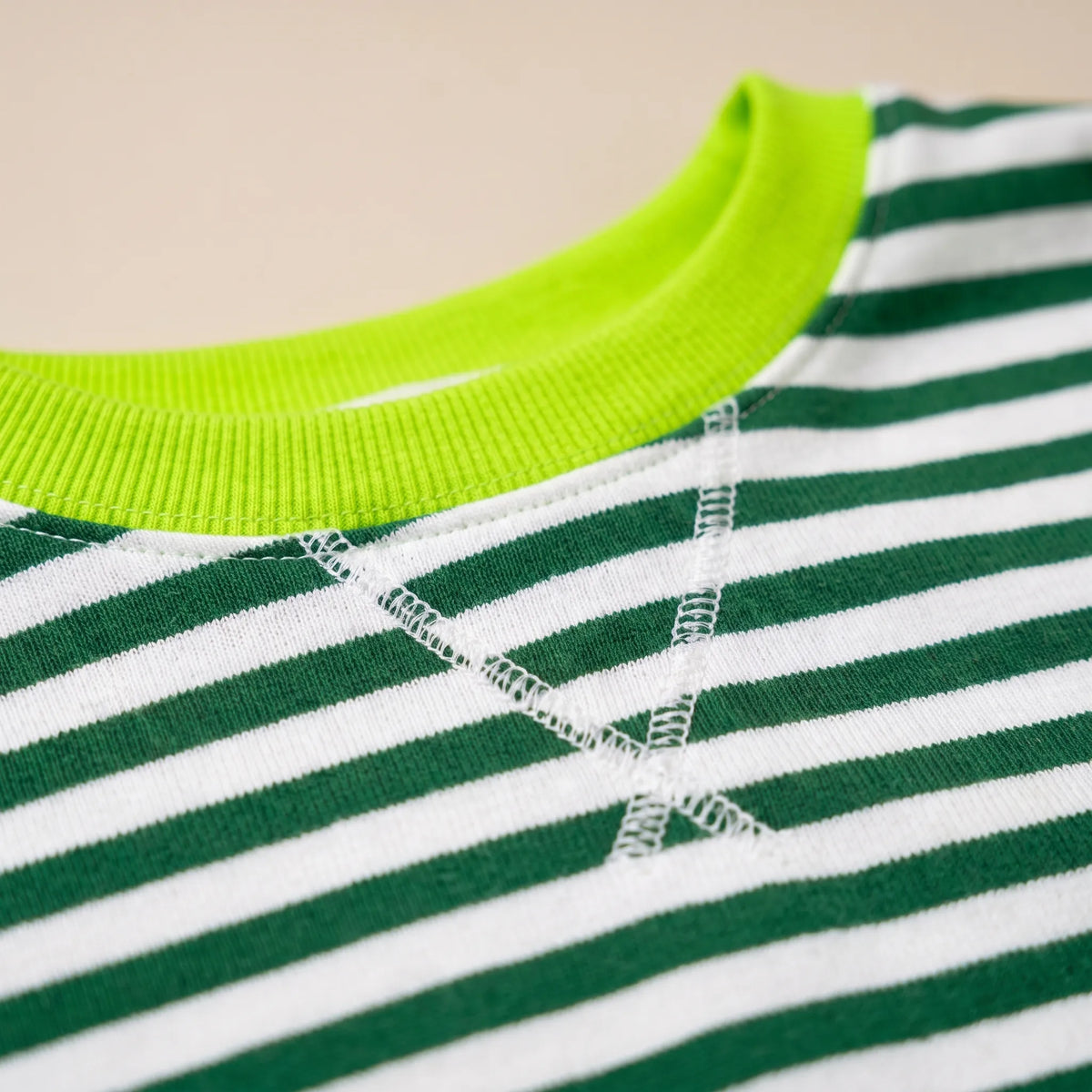 StripeCross – Oversized Striped Sweater with Round Neck and Cross-Stitch Detail